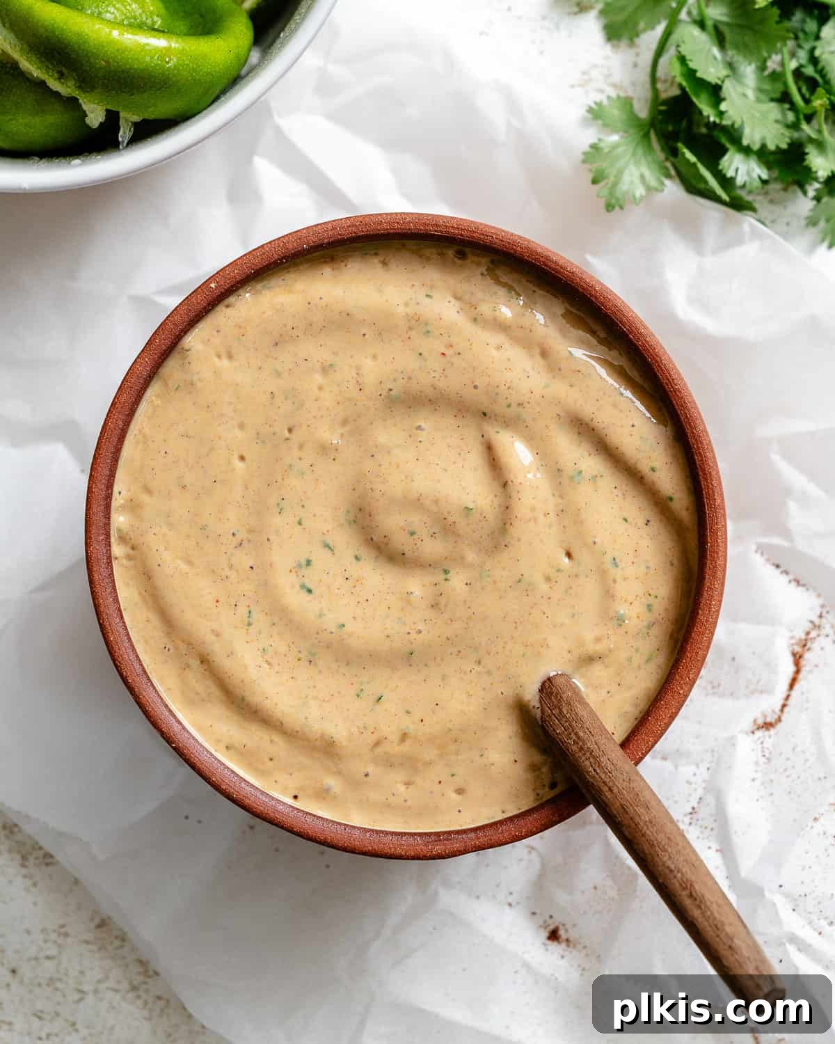 Spicy Vegan Chipotle Taco Dressing 6 Completed Vegan Chipotle Sauce in a small white bowl on a white surface