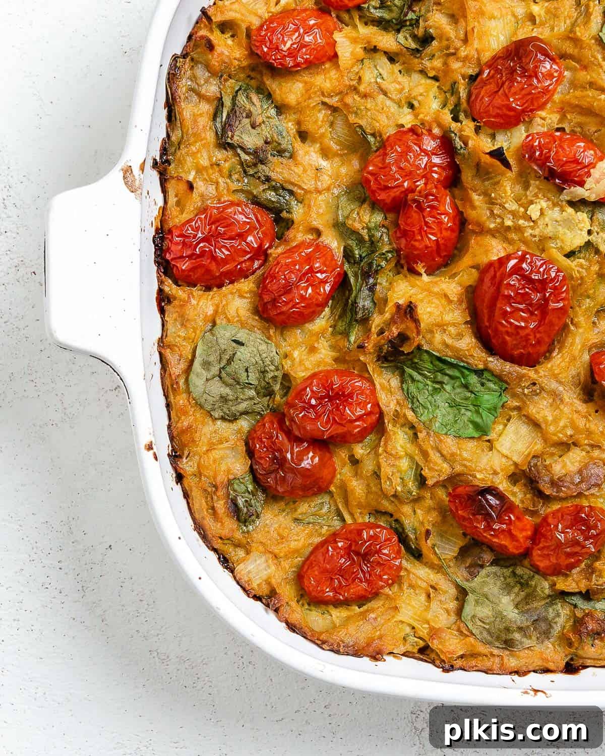completed Vegan Potato Frittata [Breakfast Casserole] in a baking tray against a light background