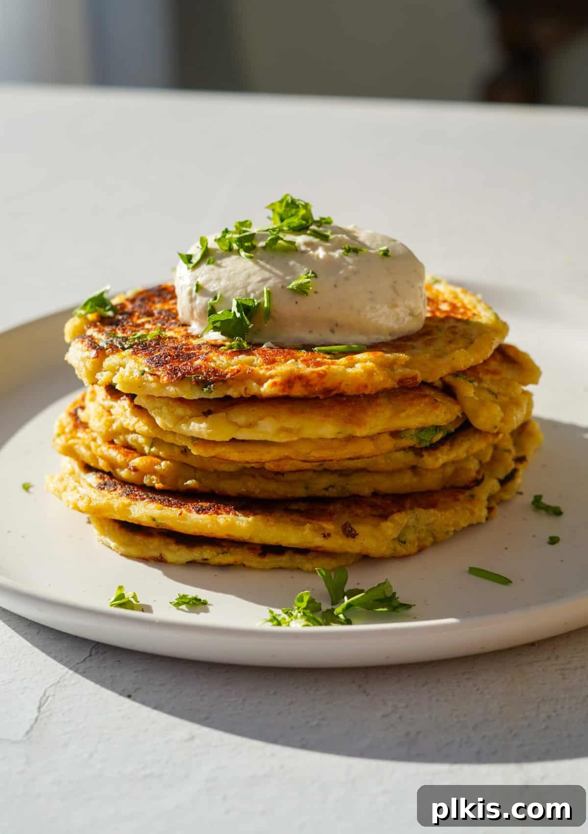 30 Effortless Plant-Based Potato Creations 16 completed Mashed Potato Pancake on a white platter