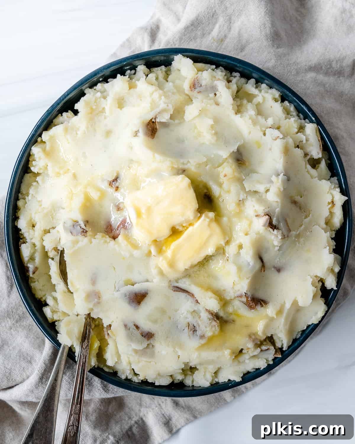 30 Effortless Plant-Based Potato Creations 8 completed vegan mashed potatoes plated against white surface