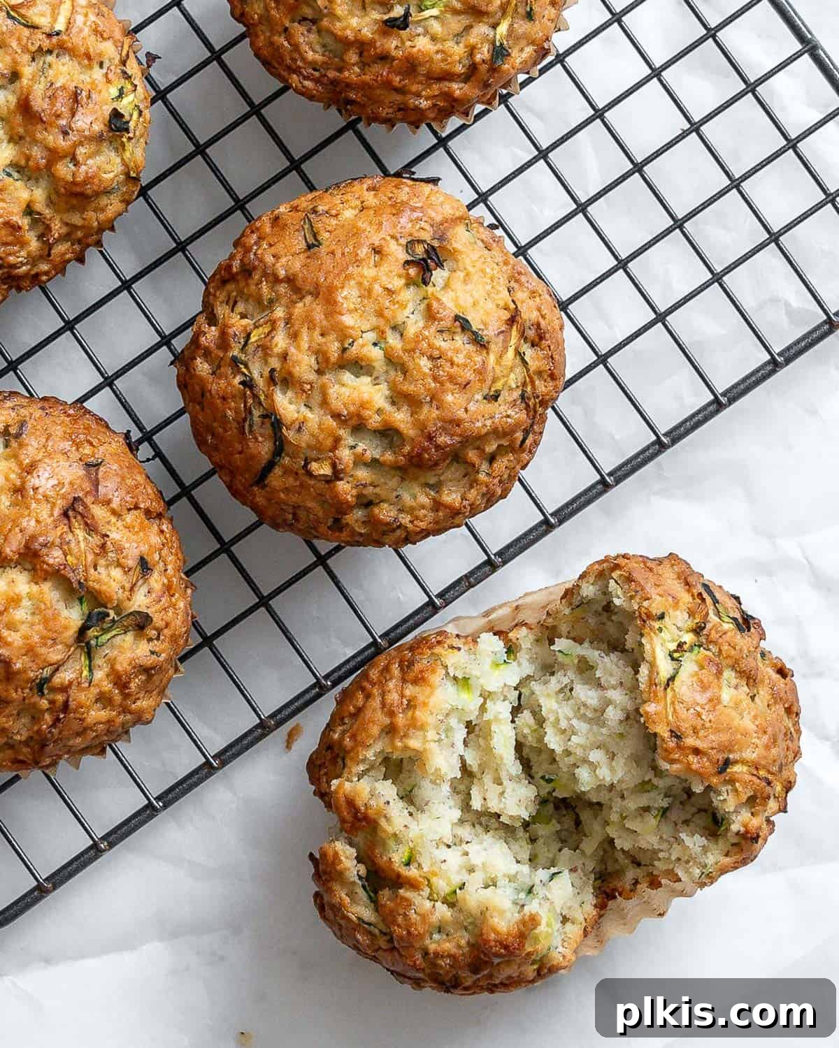 Wholesome Vegan Zucchini Muffins 10 A vibrant close-up of a completed Easy Vegan Zucchini Muffin, highlighting its perfect texture and a hint of green from the zucchini.