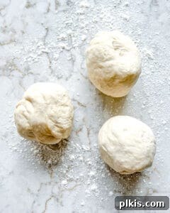 Perfect Vegan Calzones with Homemade Pizza Dough 11 three balls of dough against white surface