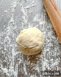 balled form of dough against gray surface