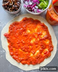 Perfect Vegan Calzones with Homemade Pizza Dough 15 process of adding marinara to Marinara Calzone