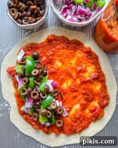 Perfect Vegan Calzones with Homemade Pizza Dough 16 process of filling Marinara Calzone with toppings