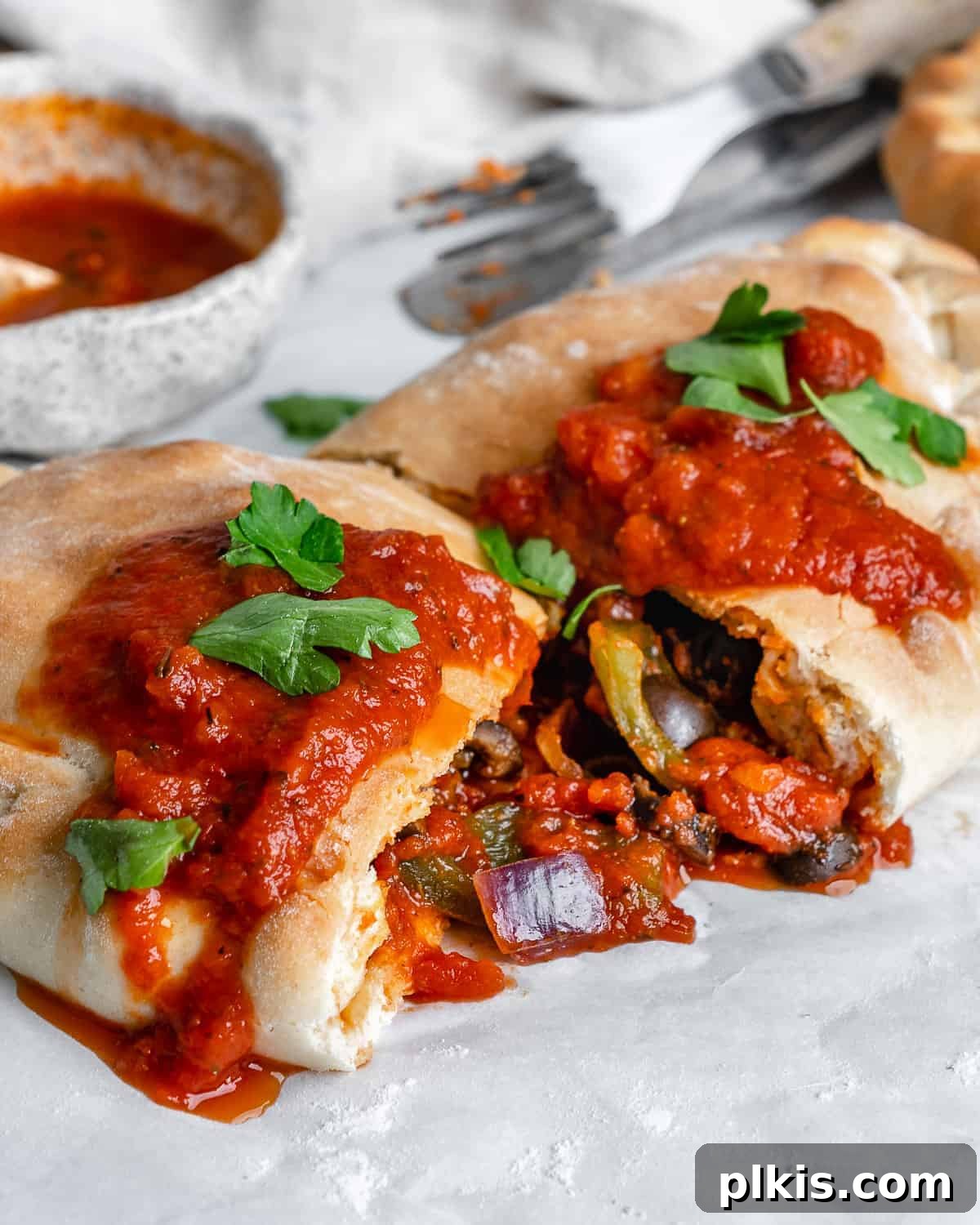 Perfect Vegan Calzones with Homemade Pizza Dough 20 completed Marinara Calzone split open in the middle
