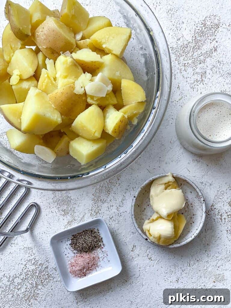 Wholesome Lentil Shepherd's Comfort 15 Plant-based milk and vegan butter added to hot, drained potatoes in a bowl.