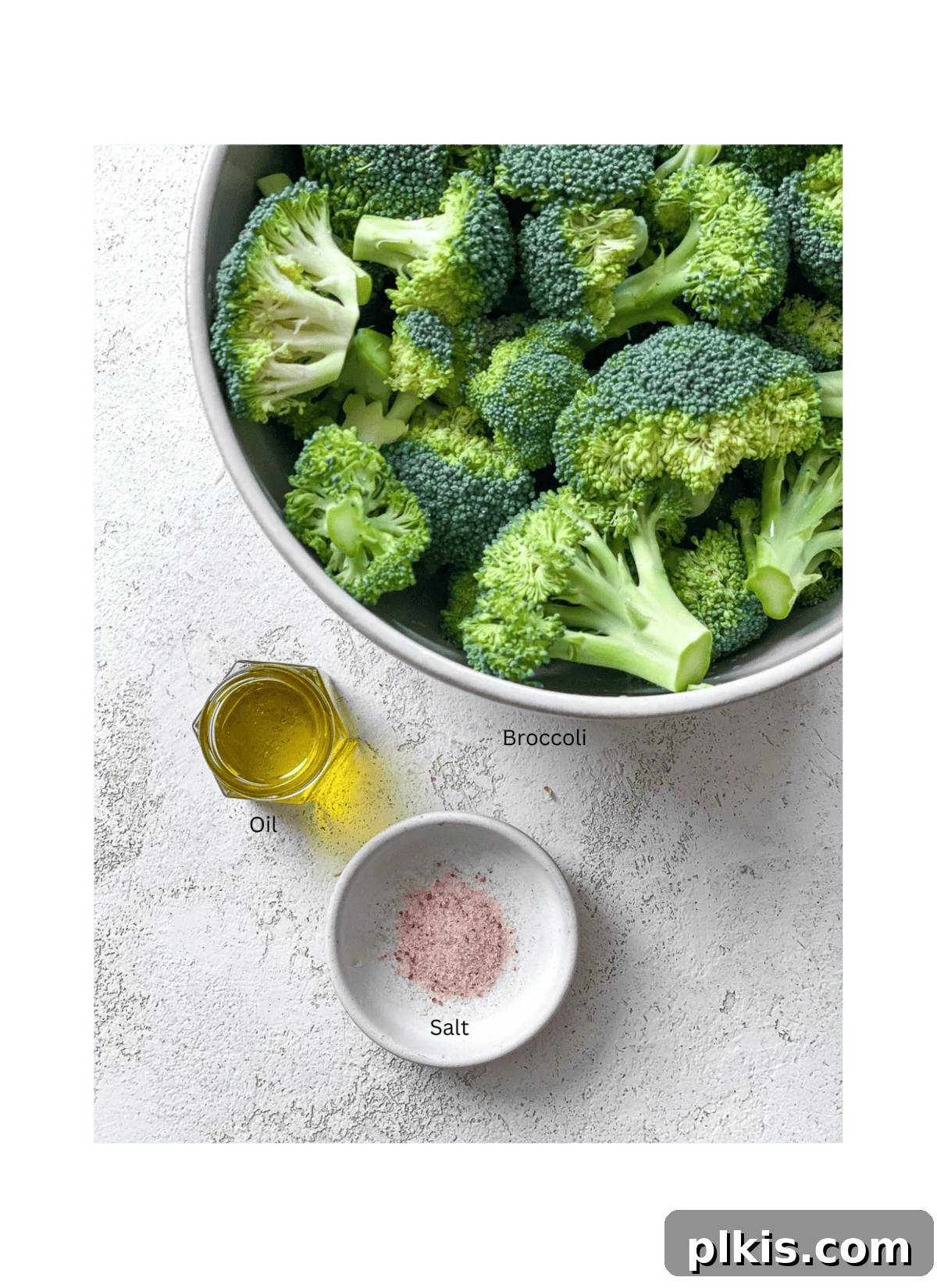 Blistered Oven Broccoli 3 ingredients for Oven Charred Broccoli measured out on a white surface