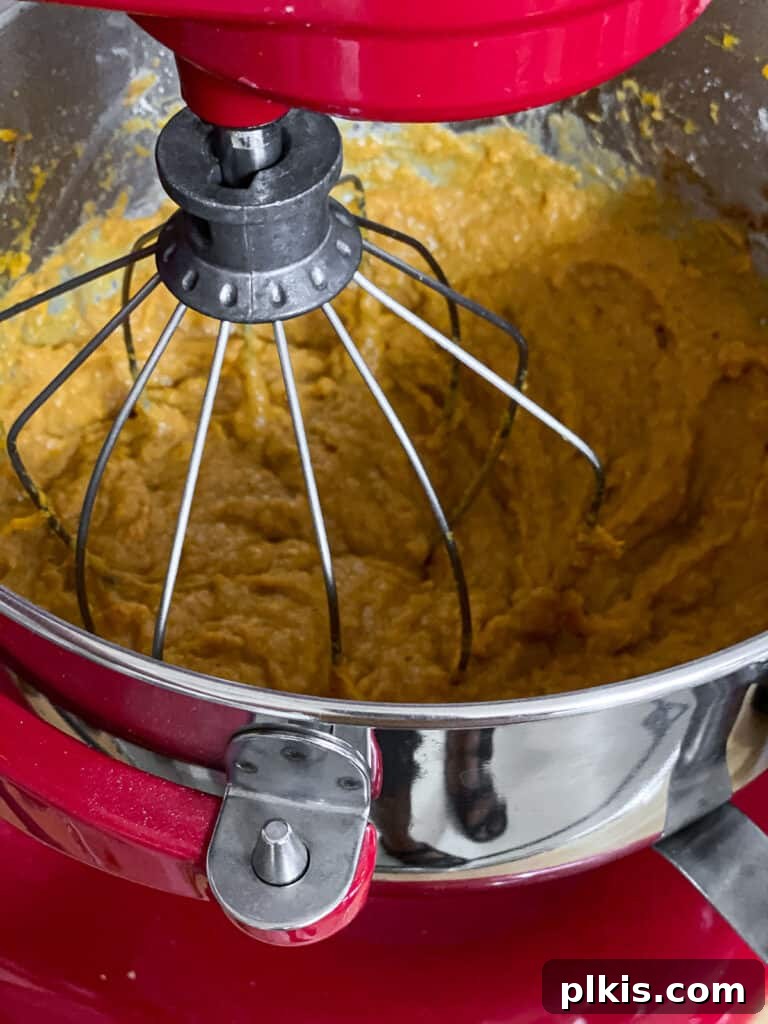 Creamy Vegan Sweet Potato Dream 11 A close-up of the sweet potato pie filling ingredients being mixed together in a bowl.