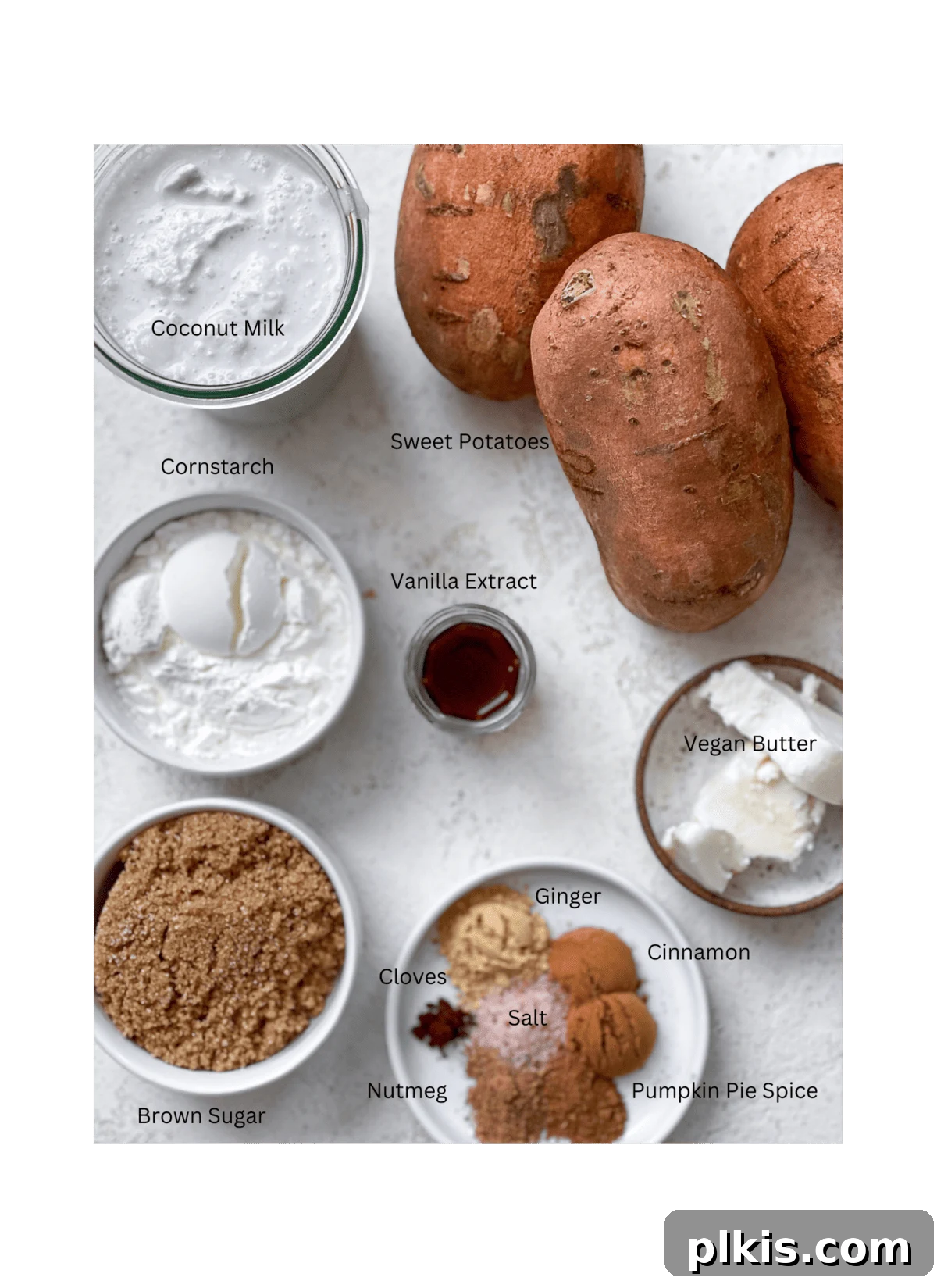 Creamy Vegan Sweet Potato Dream 3 All the necessary ingredients for Vegan Sweet Potato Pie, neatly measured out and arranged on a clean white surface, showcasing their fresh appearance.