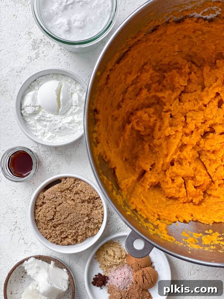 Creamy Vegan Sweet Potato Dream 9 All the dry and wet ingredients for the sweet potato pie filling measured out separately on a white surface.
