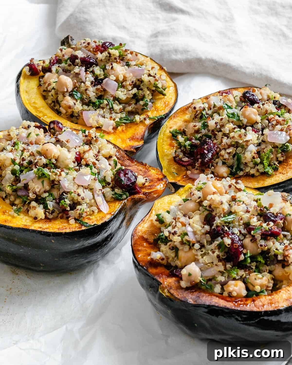 completed Vegan Stuffed Acorn Squash [With Quinoa] on a baking dish