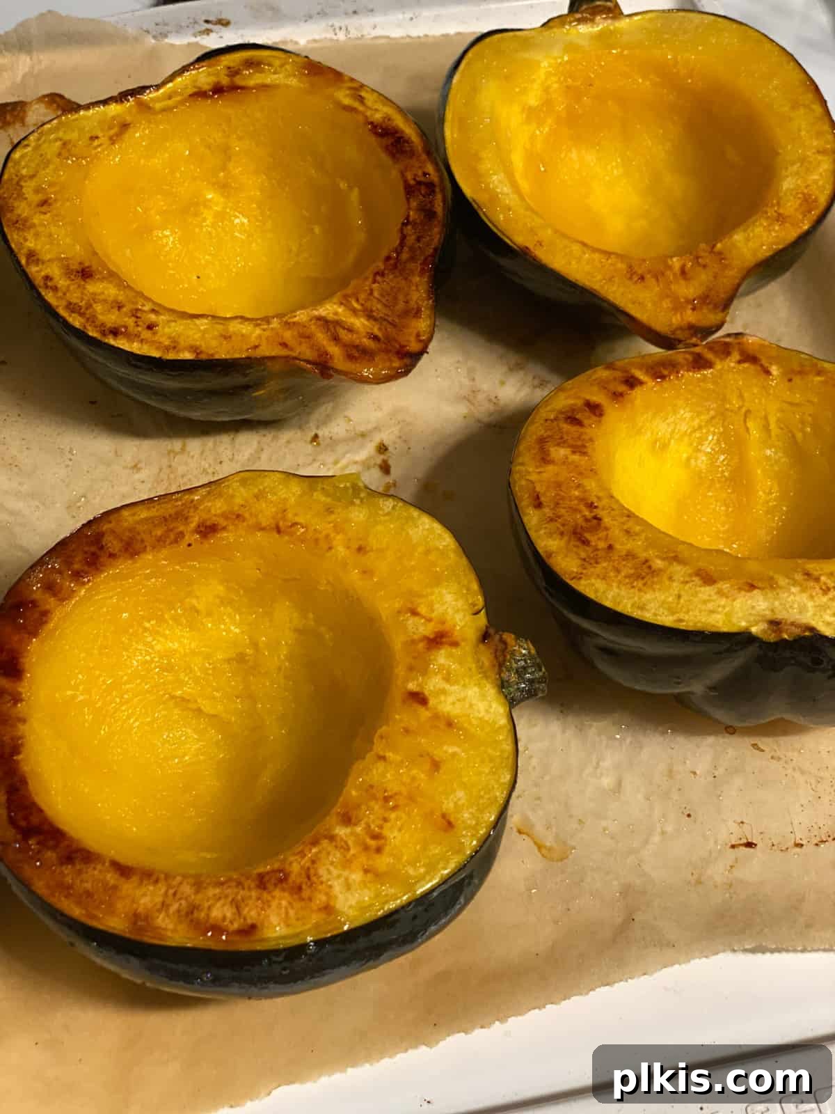 Hearty Vegan Quinoa Stuffed Acorn Squash 5 process shot showing post baked acorn squash on baking dish