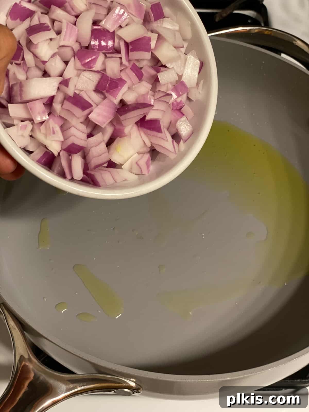 Hearty Vegan Quinoa Stuffed Acorn Squash 6 process shot of onions being added to pan