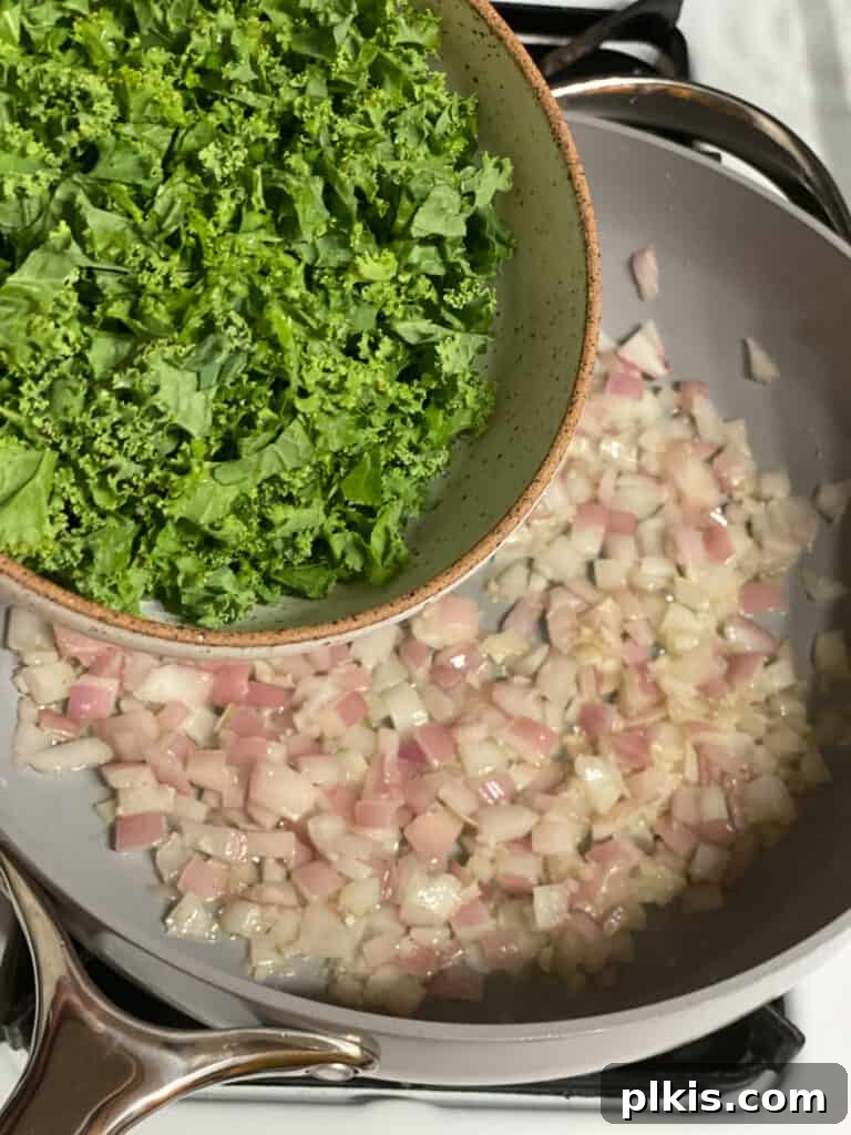 Hearty Vegan Quinoa Stuffed Acorn Squash 8 process shot of kale being added pan