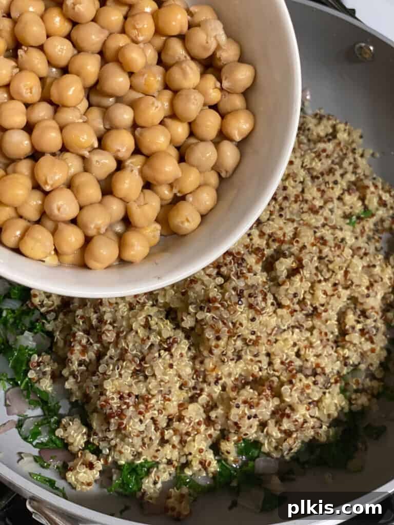 Hearty Vegan Quinoa Stuffed Acorn Squash 10 process shot of quinoa being added to pan
