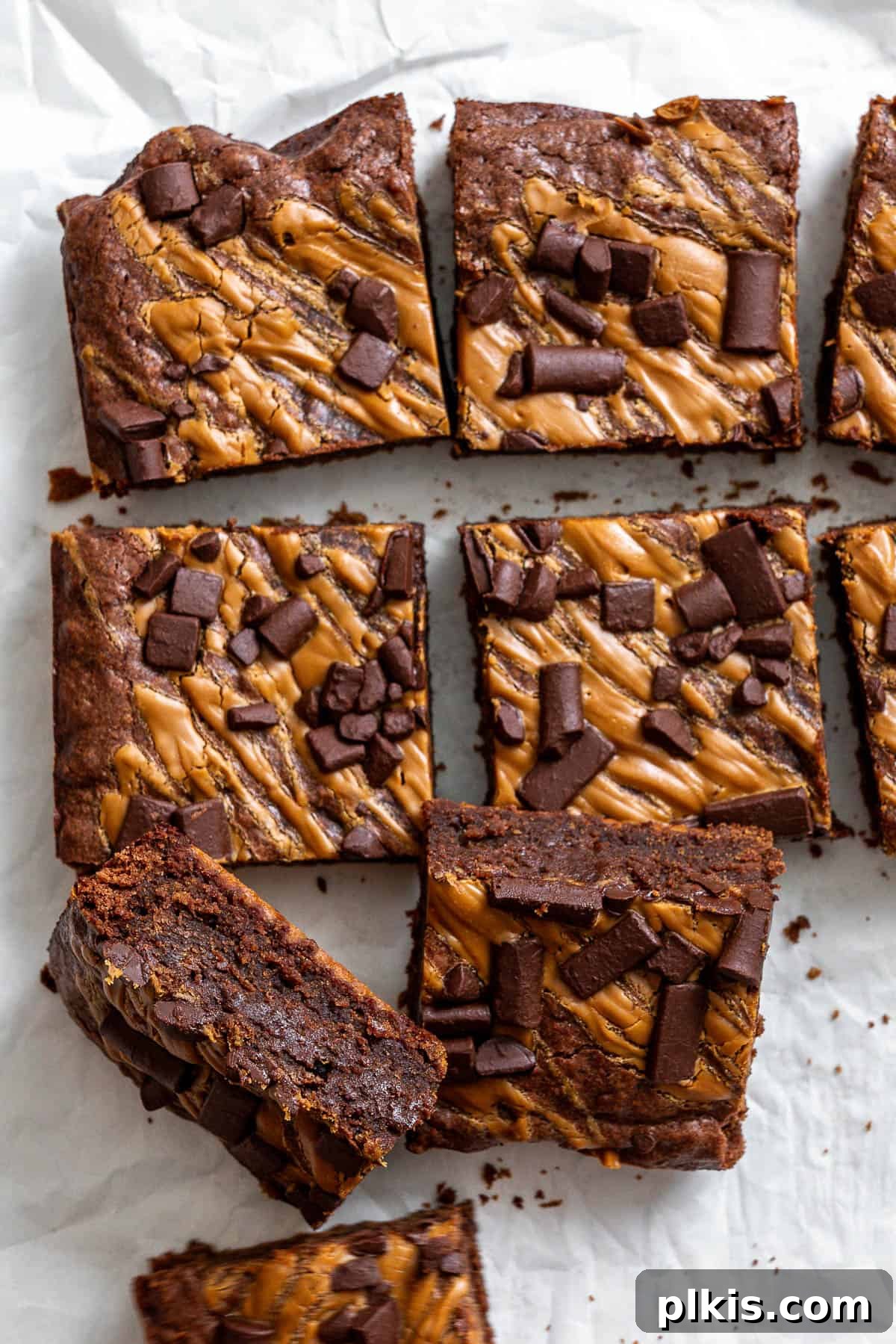 Swirled Biscoff Fudgy Brownies 2 Decadent completed Vegan Biscoff Brownies against a clean white surface, showcasing their fudgy texture and Biscoff swirl.