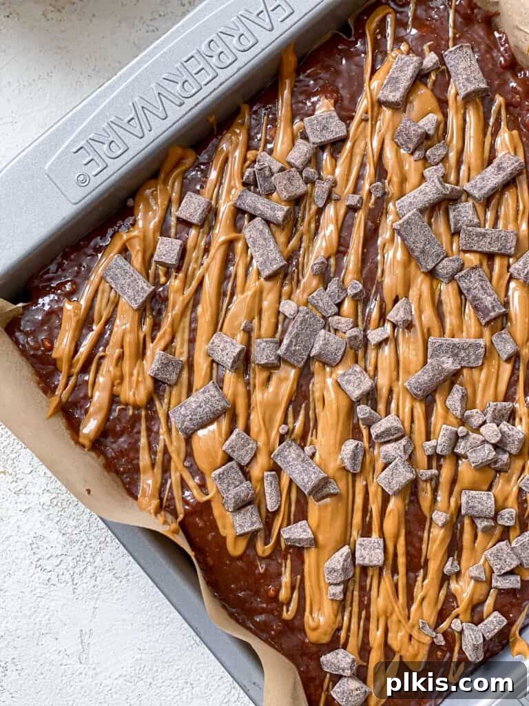 Swirled Biscoff Fudgy Brownies 7 Freshly baked Biscoff Brownies cooling in the baking dish, ready to be sliced.