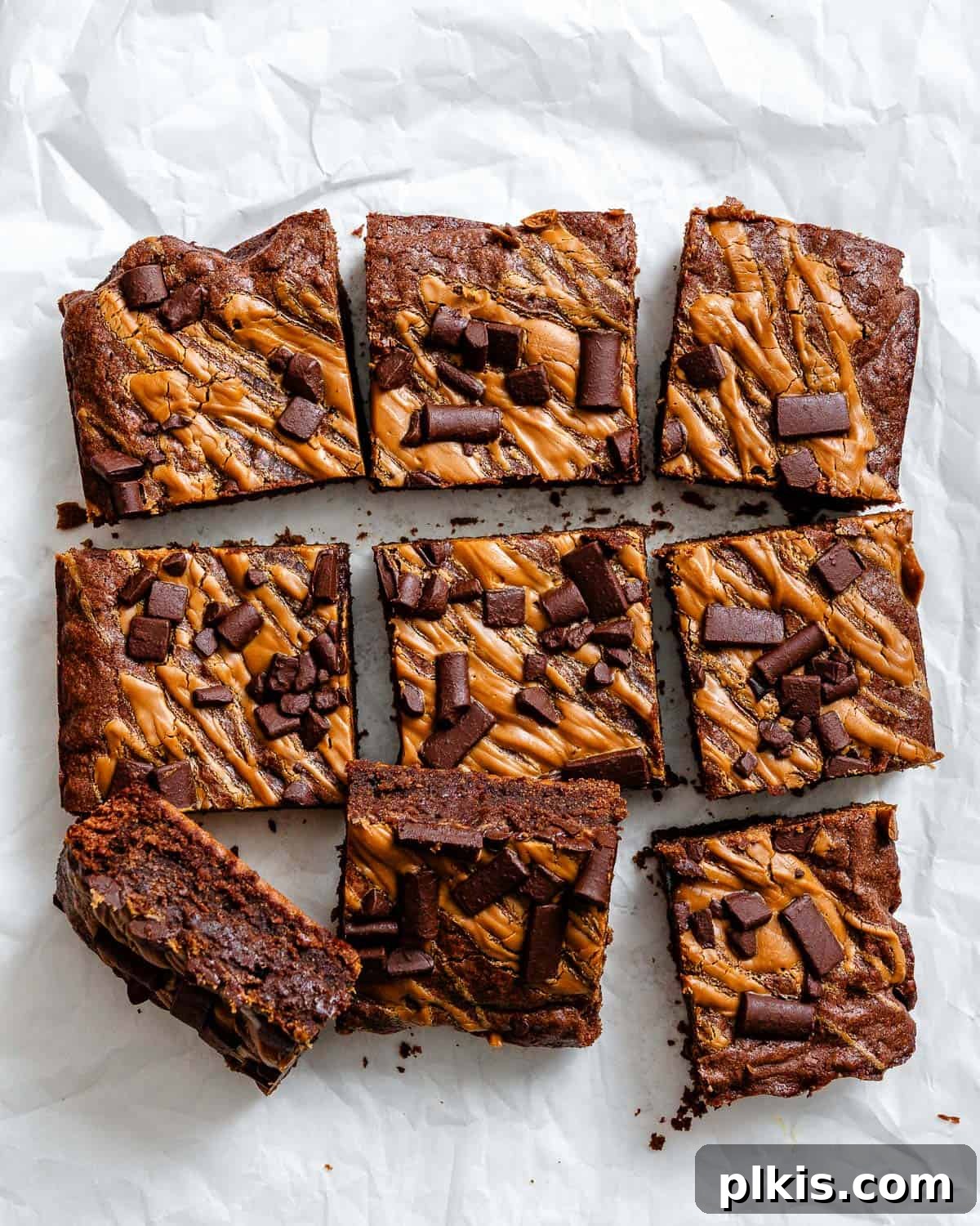 Swirled Biscoff Fudgy Brownies 8 A close-up shot of perfectly sliced Biscoff Brownies, revealing their fudgy interior and distinct Biscoff swirls.