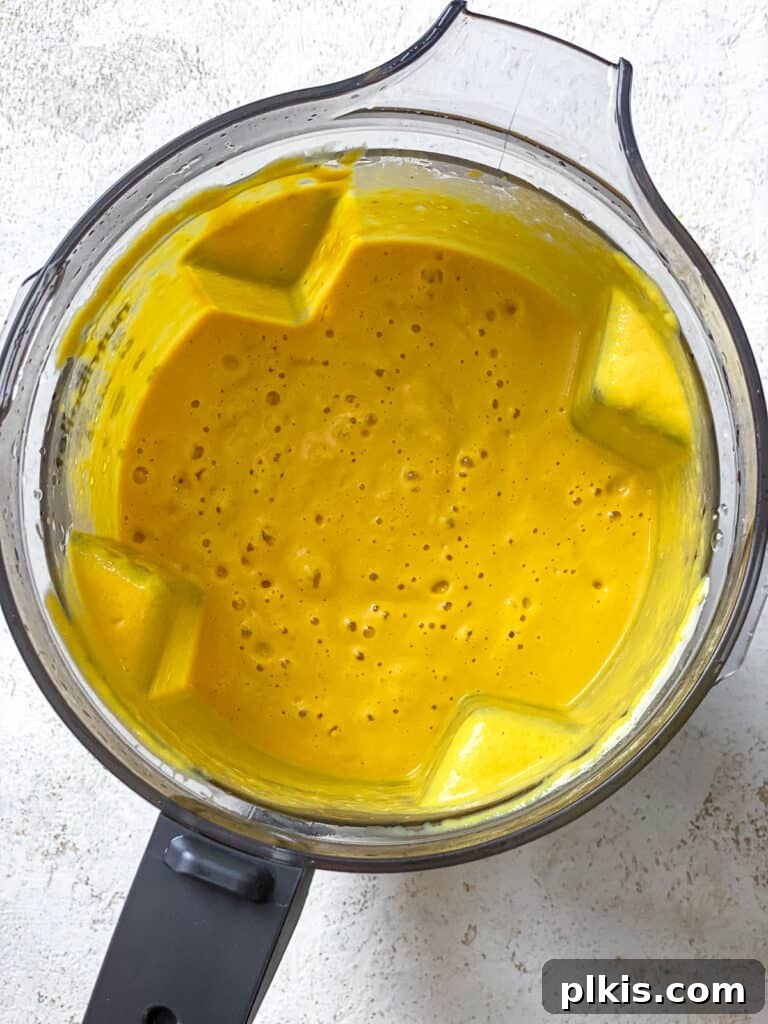 Velvety Pumpkin Pasta 9 process shot showing blended pumpkin pasta sauce, smooth and creamy in the blender