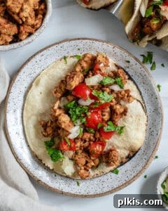 finished Chipotle Lime Street Style Tacos beautifully arranged on a plate with garnishes