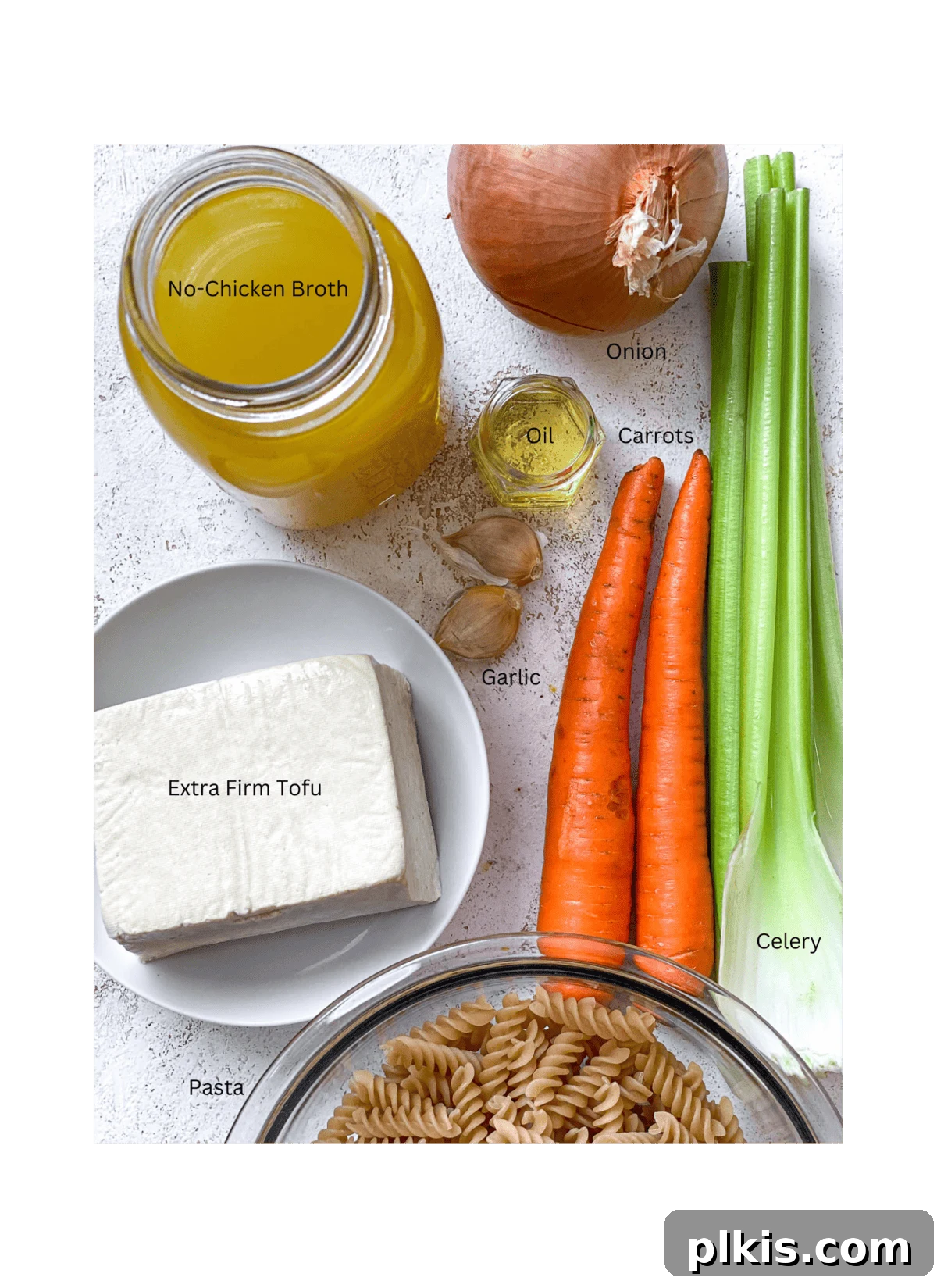 ingredients for Vegan Chicken Noodle Soup [Stove, Instant Pot, Crockpot] measured out against a white surface