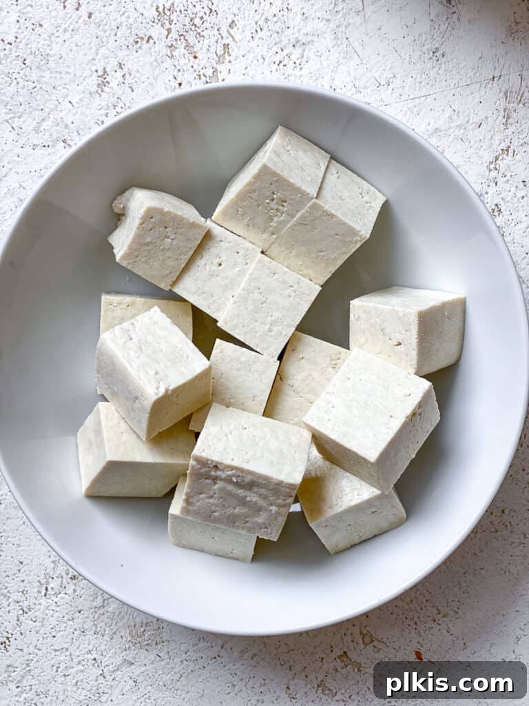Vegan Chicken Noodle Soup: Stovetop, Instant Pot, and Slow Cooker 5 cubed tofu on a white bowl
