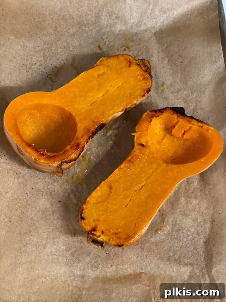 Golden Thai Squash Elixir 7 Close-up of a roasted butternut squash half, showing the tender, caramelized flesh.