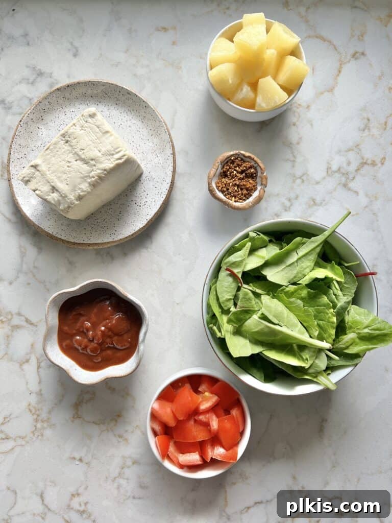 Plant-Powered BBQ Pizza 3 All the essential ingredients for vegan BBQ pizza are meticulously measured out and arranged in individual white bowls, neatly displayed on a pristine white marble surface, ready for assembly.