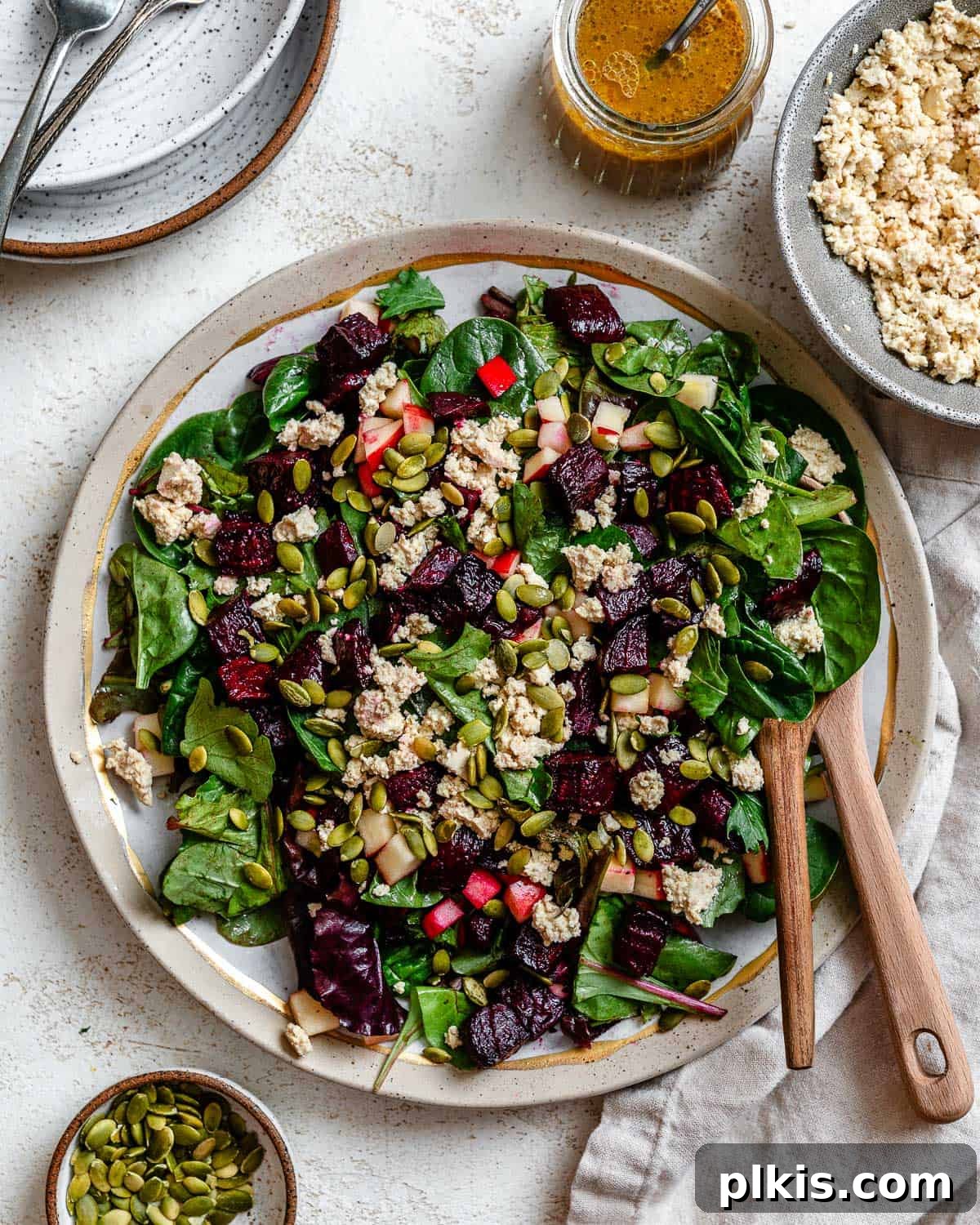 Vibrant Roasted Beet Salad with Vegan Feta and Crisp Apple 2 Beautifully plated Vegan Roasted Beet Salad with 'Feta' and Apple, showcasing its vibrant colors and fresh ingredients.