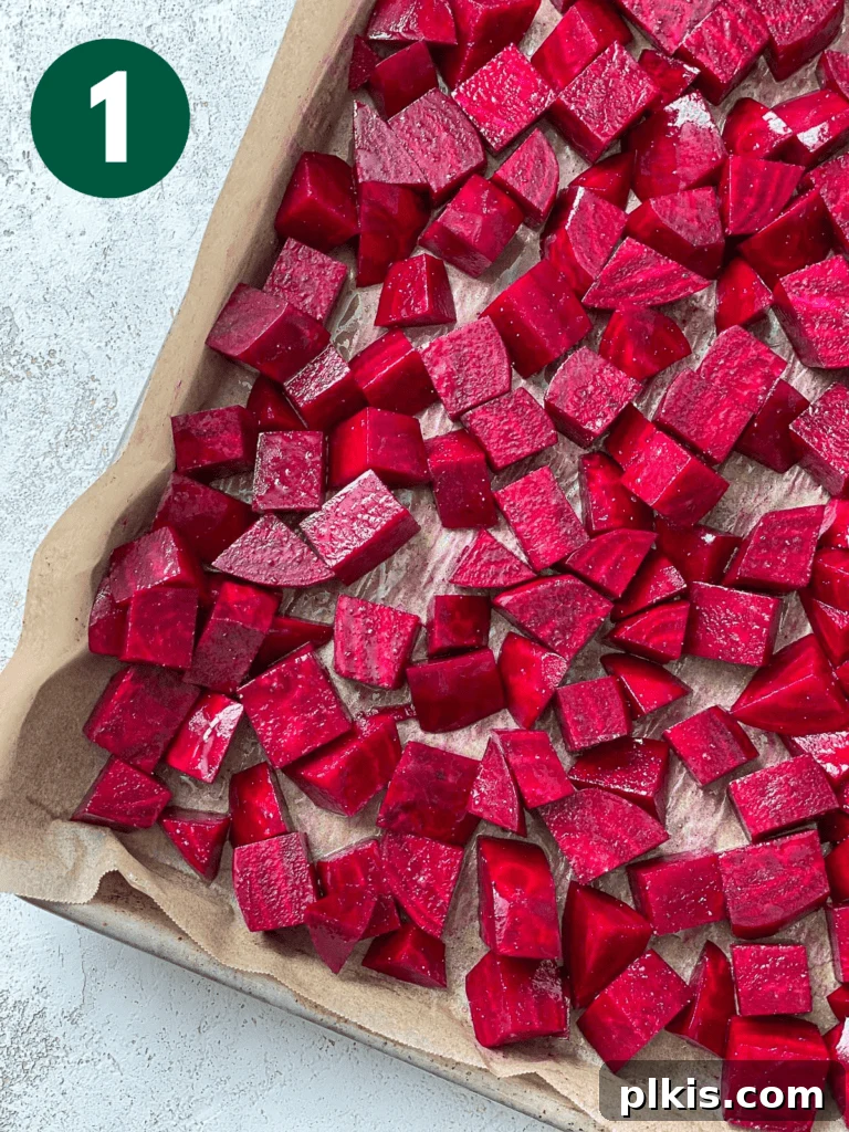 Vibrant Roasted Beet Salad with Vegan Feta and Crisp Apple 5 Cubed beets spread evenly on a baking tray, ready for roasting.