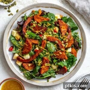Completed Easy Butternut Squash Salad ready to be served, showcasing its vibrant appeal.
