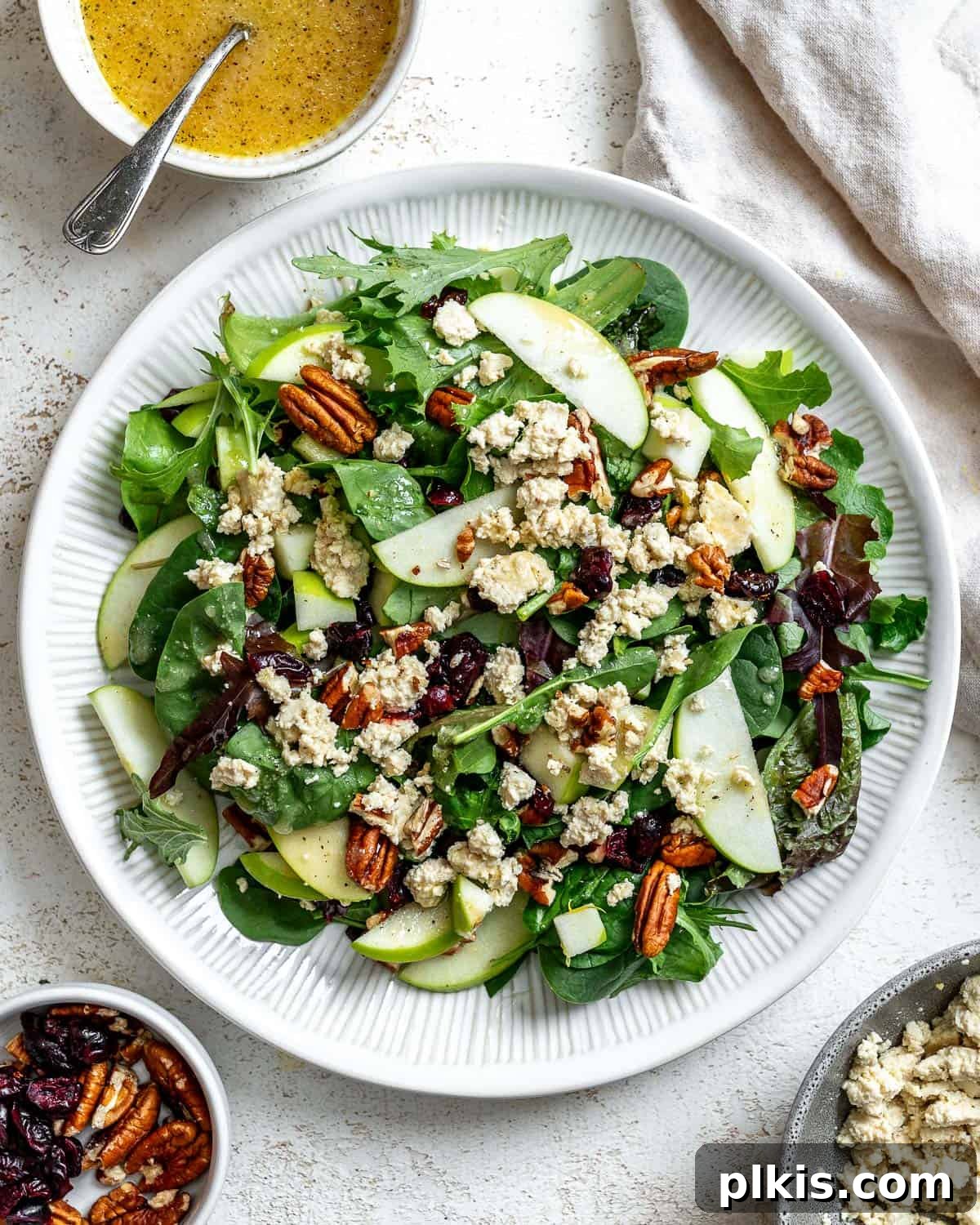 Crisp Apple Pecan Cranberry Salad 2 Delicious Easy Apple Pecan Salad with Cranberries in a serving bowl, ready to enjoy during fall and holidays.