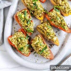 Savory Stuffed Roasted Sweet Peppers 10 finished Stuffed Roasted Sweet Peppers plated on a white tray