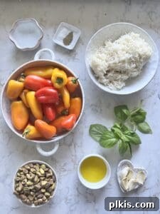Savory Stuffed Roasted Sweet Peppers 4 ingredients for Stuffed Roasted Sweet Peppers against a white background