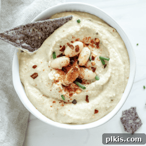 Creamy White Bean & Chive Dip 5 completed Cold White Bean Dip with Chives against a white surface