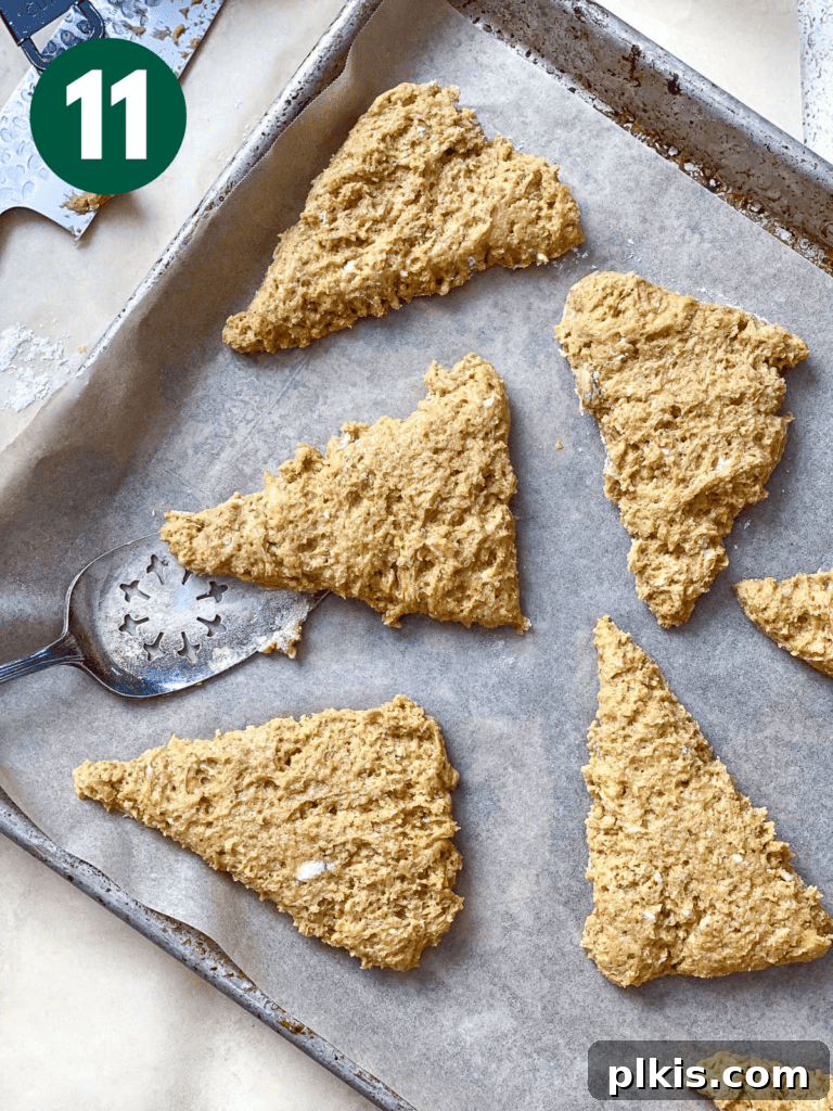 Fluffy Autumn Spiced Vegan Pumpkin Scones 13 process shot of pre baked scones on a baking dish