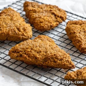 Fluffy Autumn Spiced Vegan Pumpkin Scones 16 completed Vegan Pumpkin Scones on a cooling rack