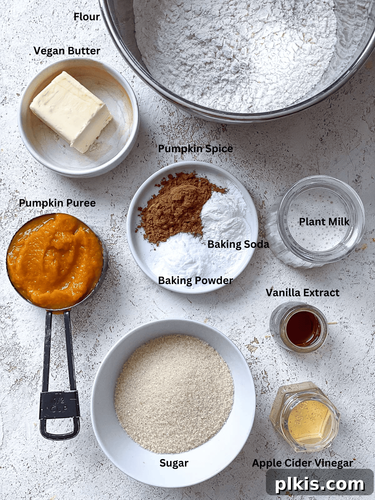 Fluffy Autumn Spiced Vegan Pumpkin Scones 3 ingredients for Vegan Pumpkin Scones on a white surface