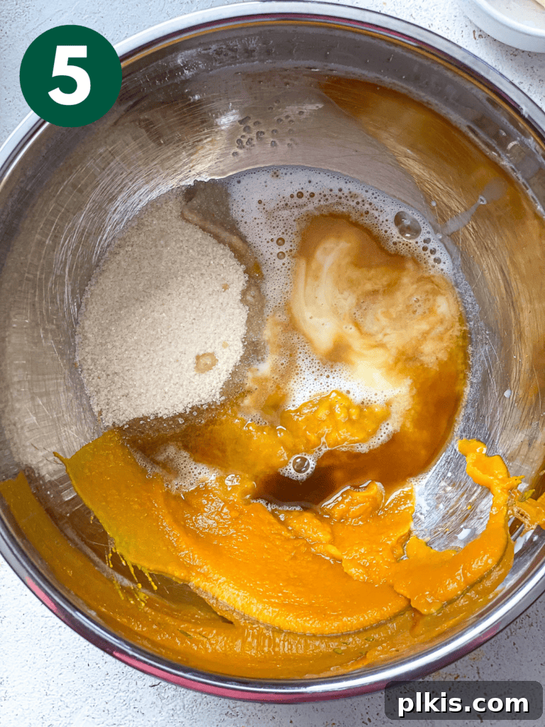 Fluffy Autumn Spiced Vegan Pumpkin Scones 8 process shot of adding ingredients to bowl