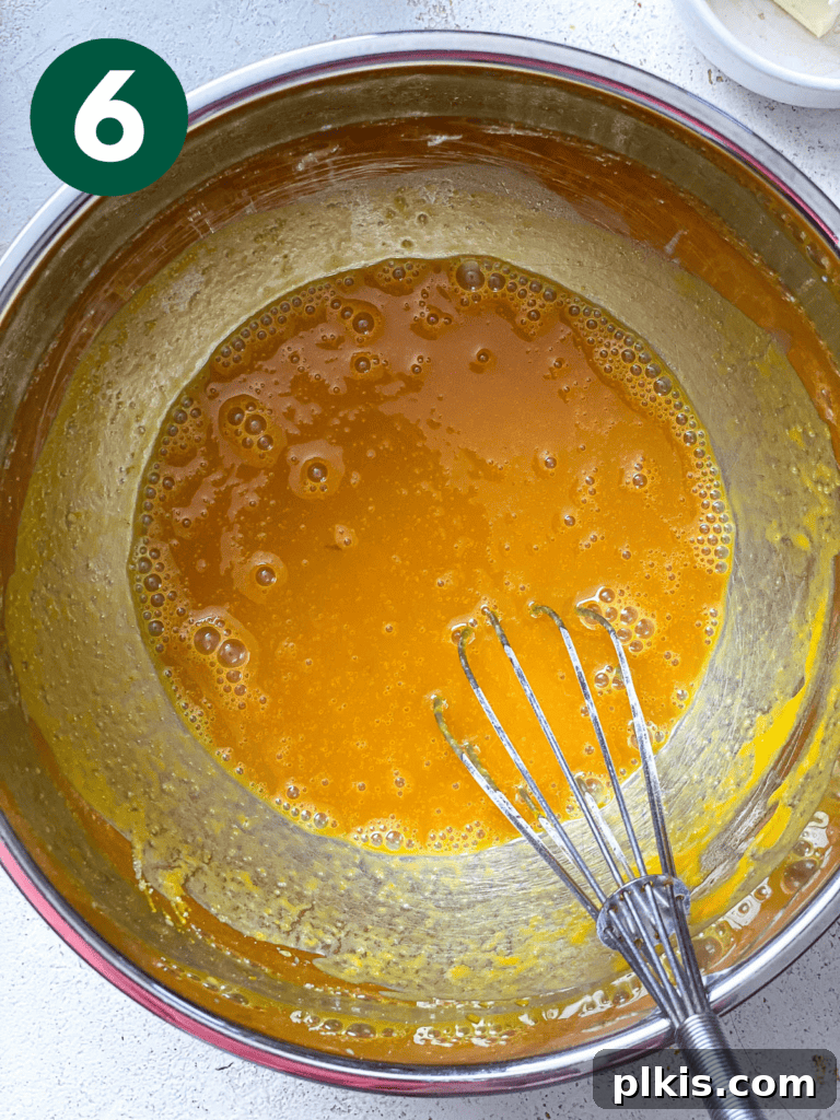 Fluffy Autumn Spiced Vegan Pumpkin Scones 9 process shot of mixing ingredients together in a bowl