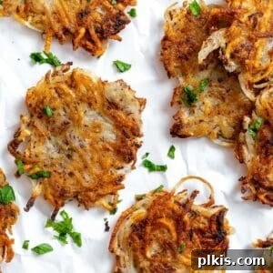 Crispy Vegan Potato Latkes 12 completed Vegan Potato Latkes on a white surface
