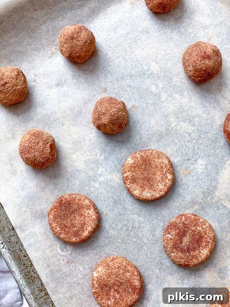 Effortless Vegan Snickerdoodle Delights 9 process shot showing showing balls of dough on baking sheet