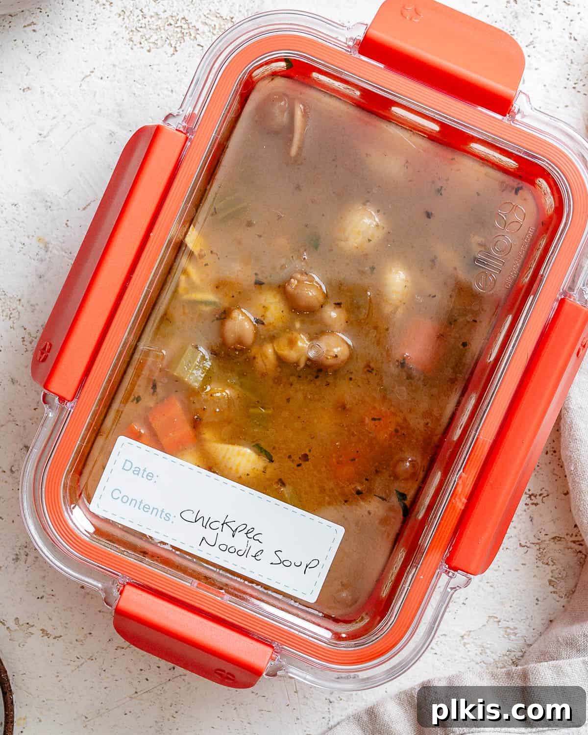 Comforting Vegan Chickpea Noodle Soup 9 Vegan Chickpea Noodle Soup stored in an airtight meal prep container, ready for refrigeration or freezing.