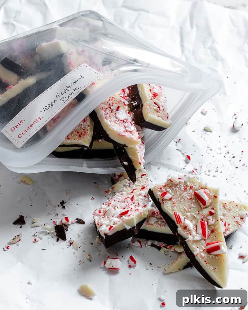 Completed Vegan Peppermint Bark pieces stored in a clear reusable silicone bag, ready for storage.