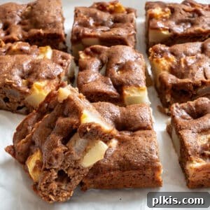 Plant-Based Pear Bliss 13 completed Vegan Pear Cake slices on a white surface