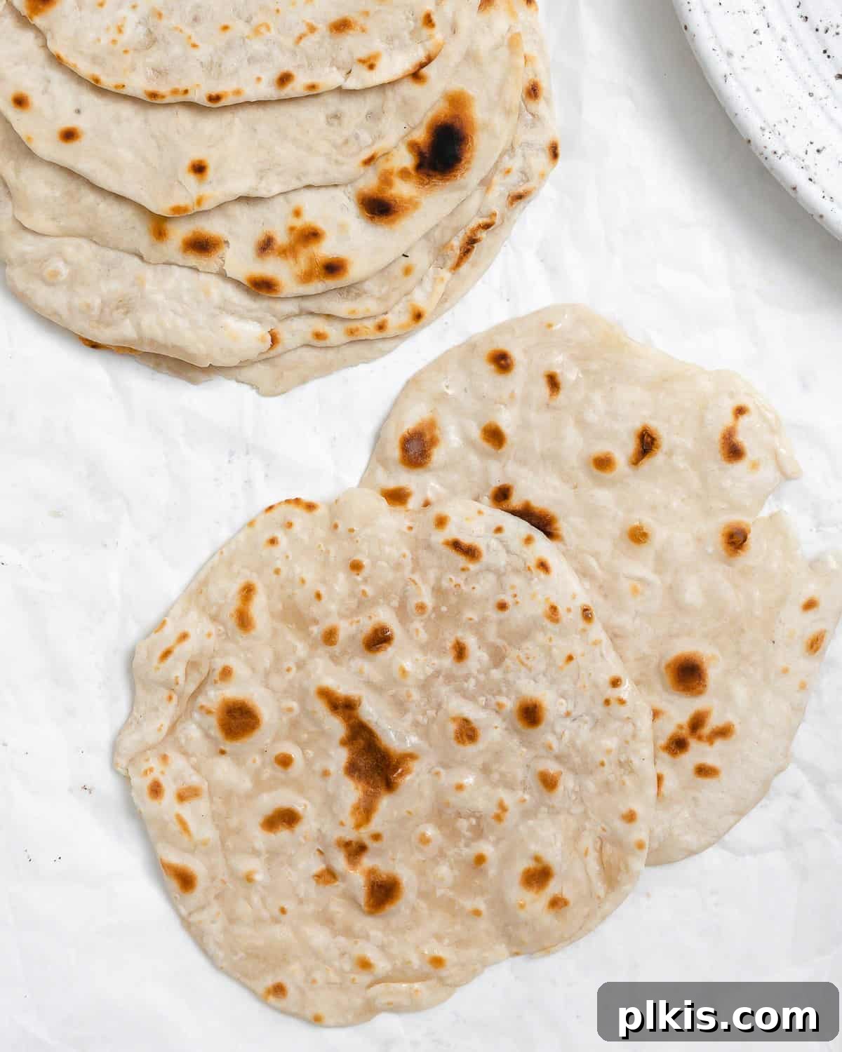 Delicate Chinese Wraps 19 A final, enticing image of perfectly cooked Mandarin Pancakes, stacked and ready to be used as wraps for a delicious meal.