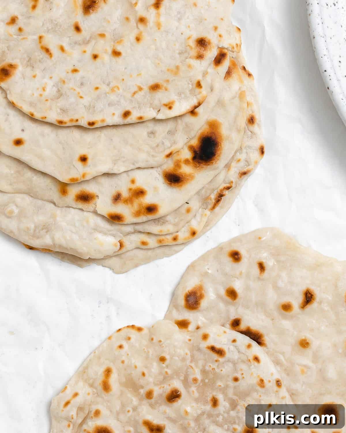 Delicate Chinese Wraps 21 A beautifully presented stack of freshly made Mandarin Pancakes, emphasizing their soft texture and appeal as a versatile wrap.