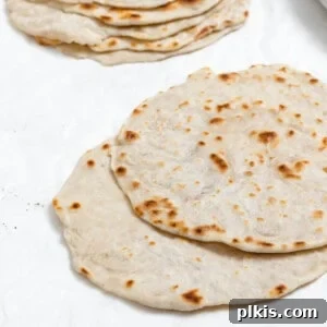 completed Mandarin Pancakes stacked on one another against a white background