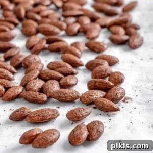 completed cinnamon almonds against a white surface